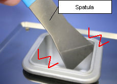When a metallic object (spatula, etc.) is hit against the pot while removing solder wastes.